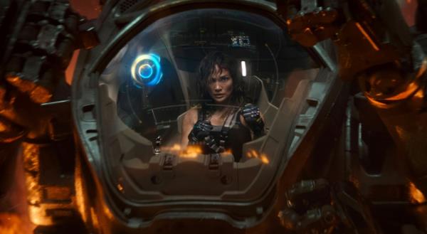 Jennifer Lopez seated in a robot