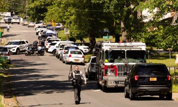 A suspect open fired on the officers while they were attempting to serve a warrant.