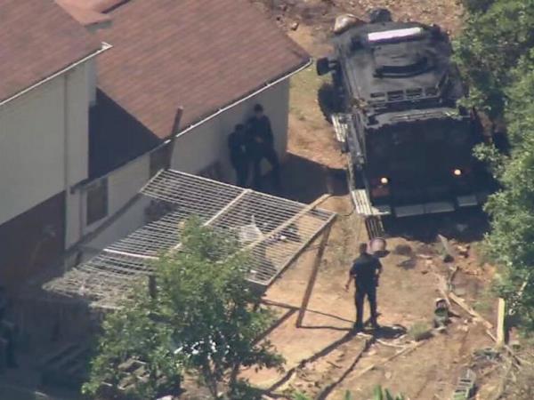 Law enforcement officers at the house after the shooting.