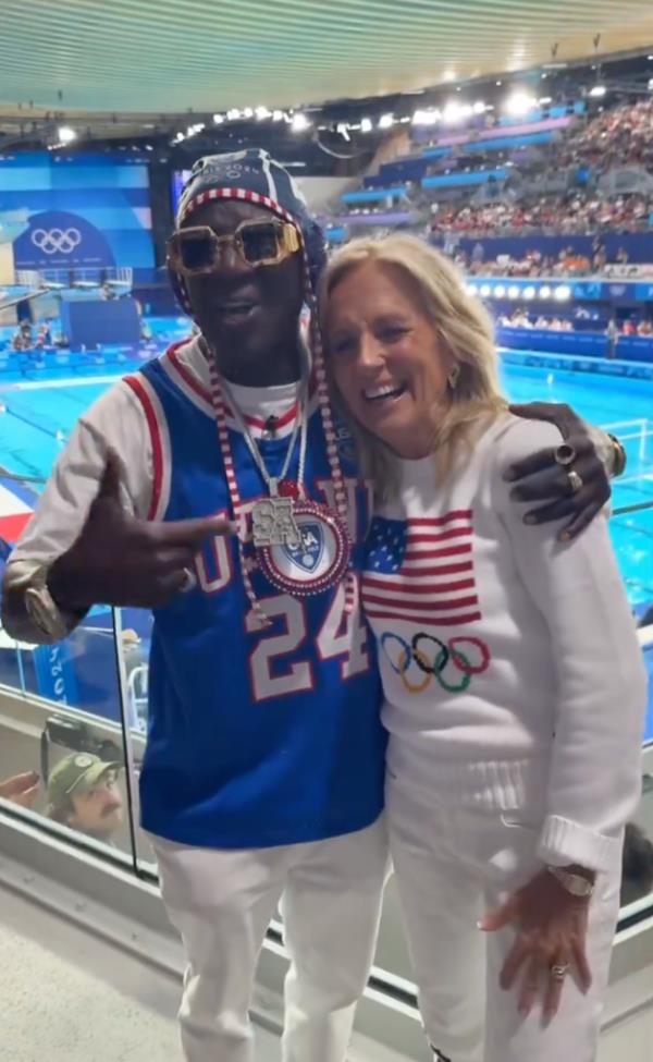 Flavor Flav (L.) embraces Jill Biden at the 2024 Paris Olympics on July 27, 2024.