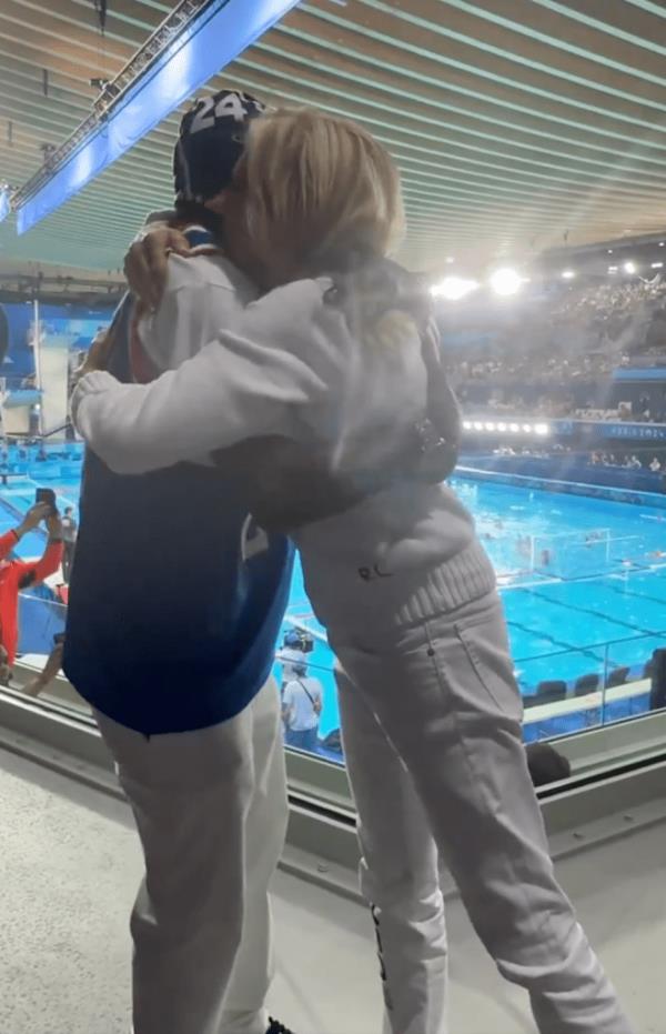 Flavor Flav (L.) embraces Jill Biden at the 2024 Paris Olympics on July 27, 2024.