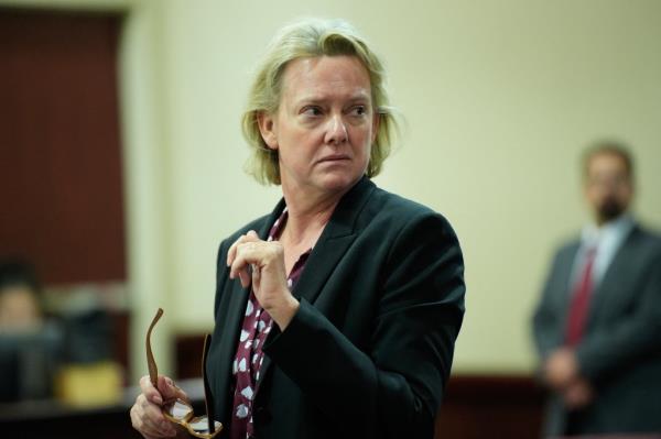 Kari Morrissey in court room with shocked face.