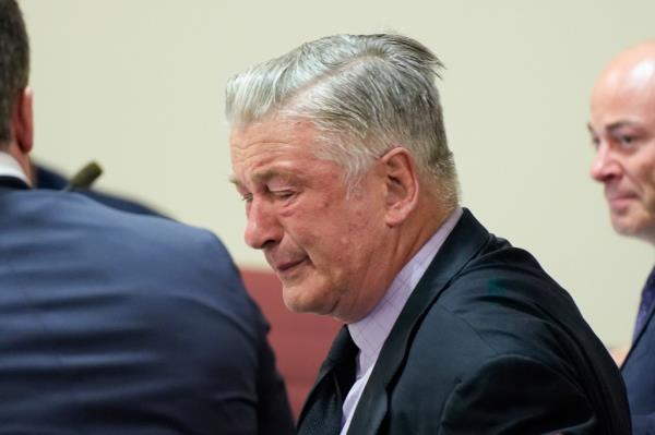 Alec Baldwin crying in suit in court.