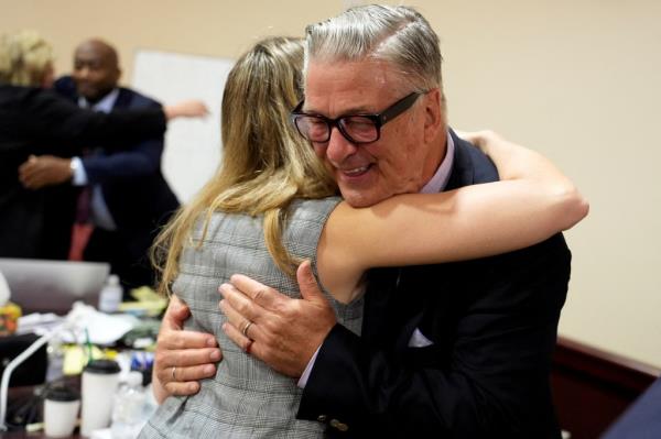 US actor Alec Baldwin hugs a member of his legal team at the co<em></em>nclucion of his trial on involuntary manslaughter at Santa Fe County District Court in Santa Fe, New Mexico, on July 12, 2024.