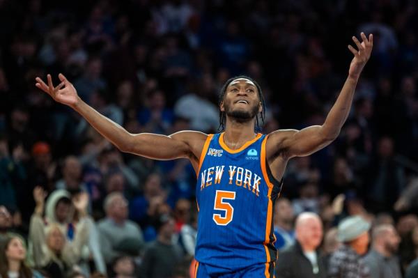 New York Knicks guard Immanuel Quickley (5) reacts after New York Knicks guard Jalen Brunson (11) hits a shot during the second half.