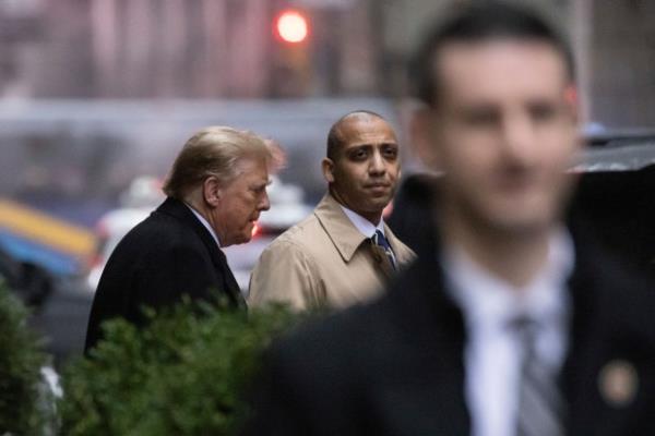 Former President Do<em></em>nald Trump leaves his apartment building, Friday, Jan 26, 2024, in New York. Closing arguments are to begin Friday in the defamation case against Trump a day after the former president left a New York courtroom fuming that he hadn't been given an opportunity to refute E. Jean Carroll's sexual abuse accusations. (AP Photo/Yuki Iwamura)