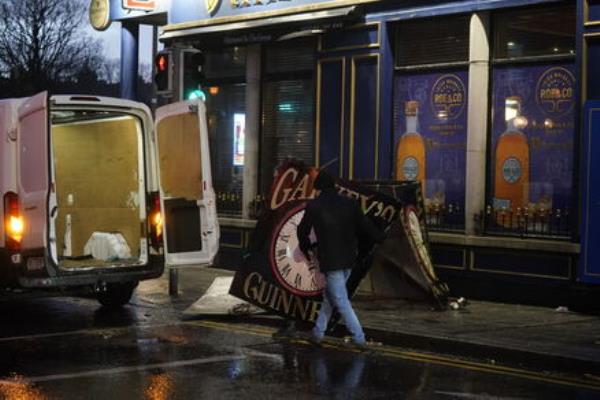 A clock tower falls to the ground in Eyre Square, Galway, during Storm Isha. Picture: Niall Carson/PA Wire